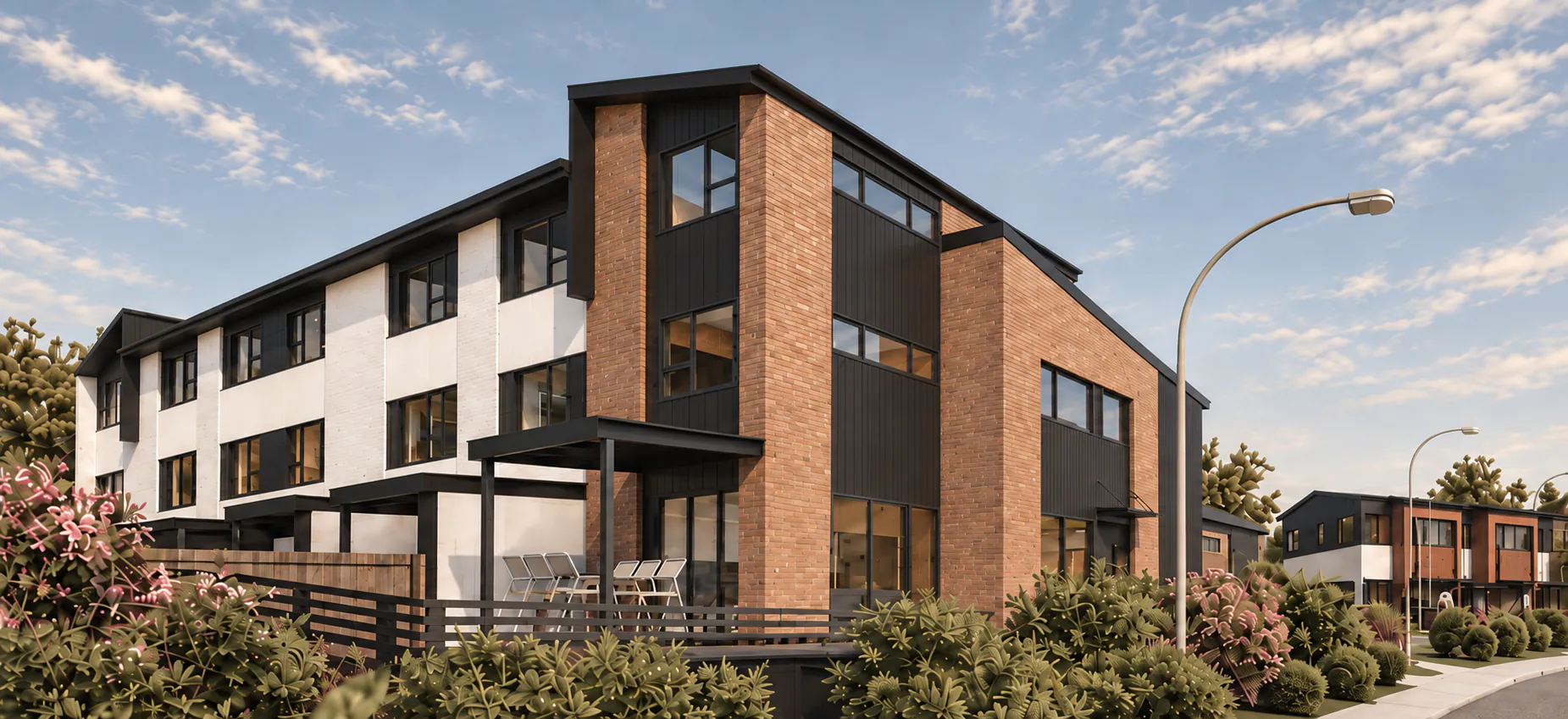 AI-retouched project image of the Glen Innes multi-unit development, showing brick, charcoal and ivory facades in warm sunlight.